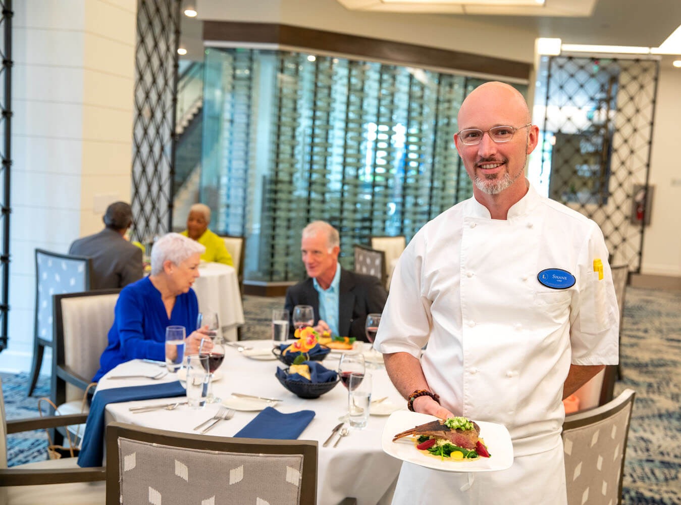Arbor chef serving meal at indoor restaurant