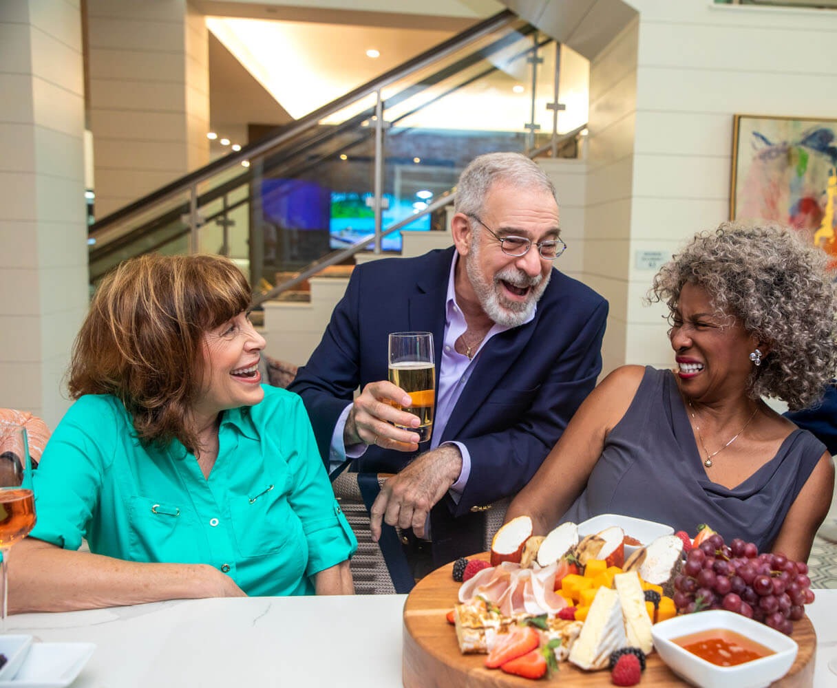 Residents laughing at happy hour