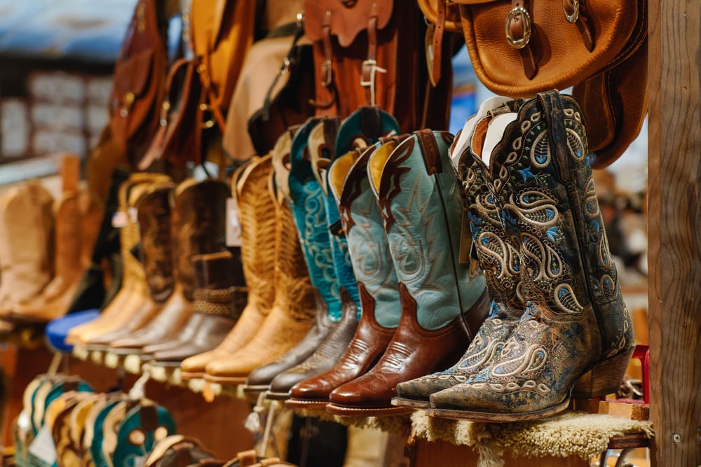 A colorful display of handcrafted cowboy boots at a local market, celebrating the rich Texas culture and charm surrounding Arbor Terrace Lakeway, a senior living community in Lakeway, TX.