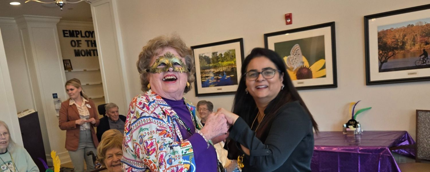 New Jersey - resident wearing a mask and dancing with staff