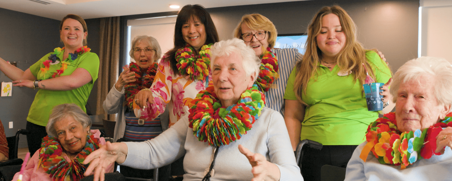 New Jersey - senior ladies and staff wearing luau garlands