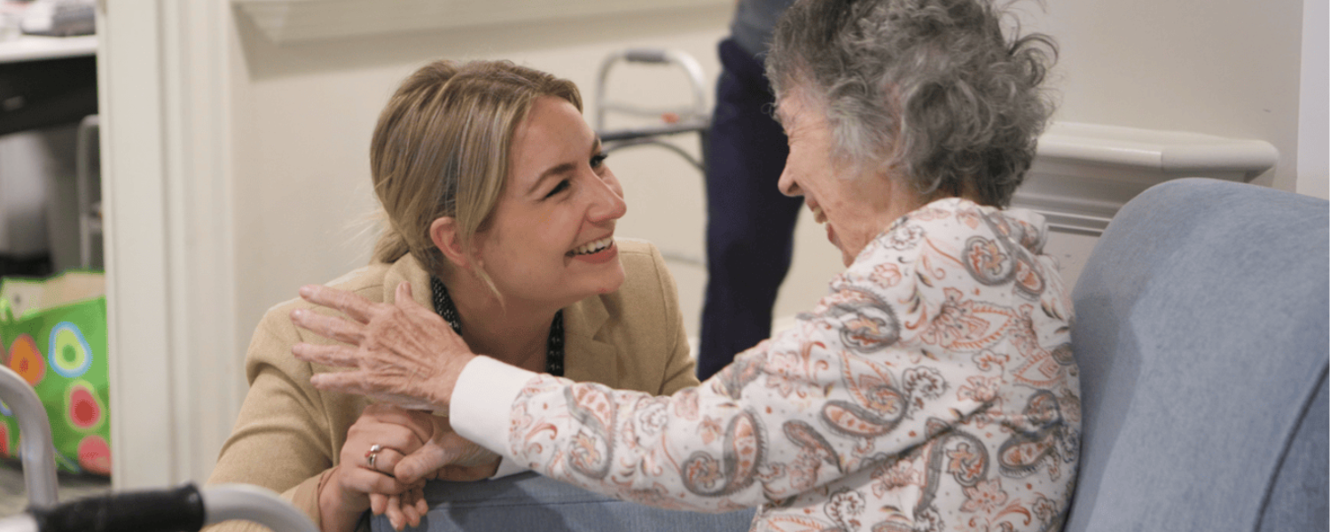Exton - staff smiling with resident