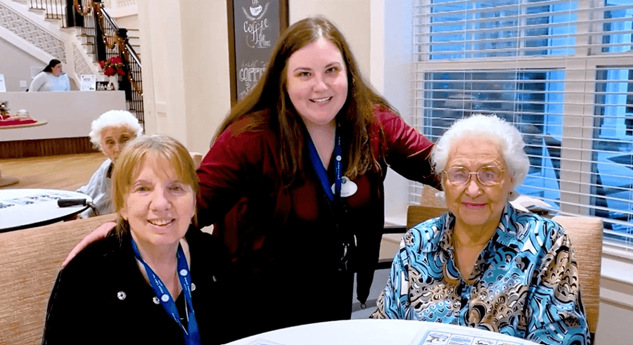 Arbor Terrace Marlton residents with a staff member smiling