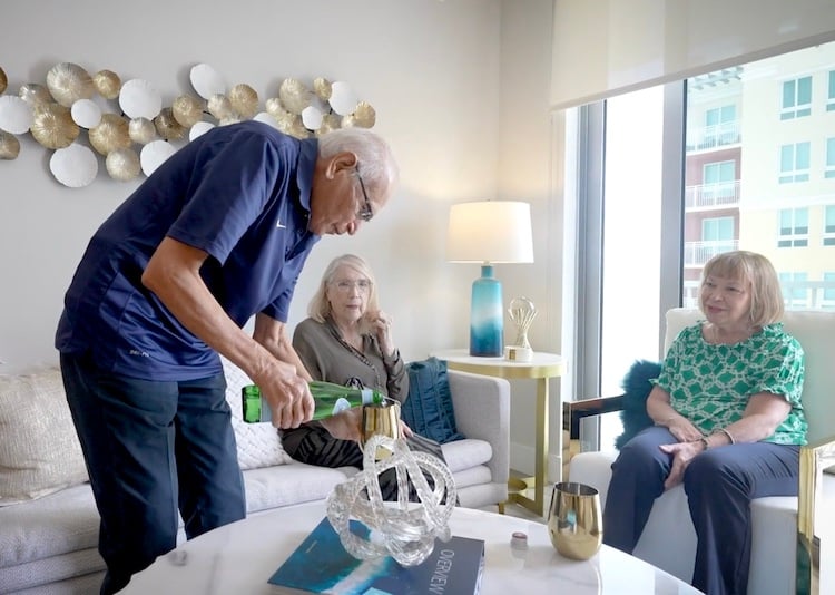 Residents enjoy a relaxed gathering in a beautifully furnished apartment at Mirabelle, reflecting the warm community feel and top-tier services found at assisted living communities in Miami, FL.