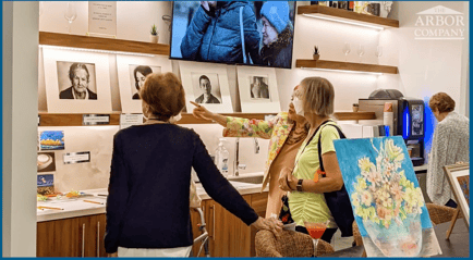 Residents looking at the displayed artwork