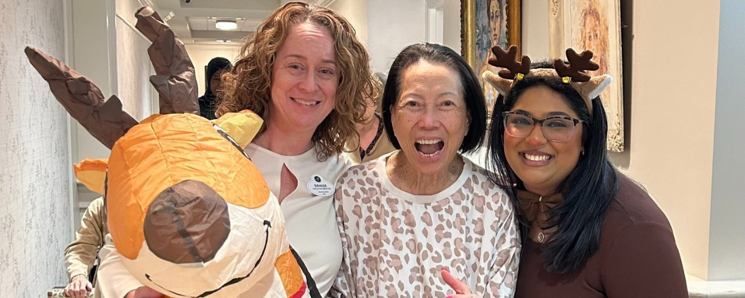 New Jersey - senior resident and staff posing with reindeer