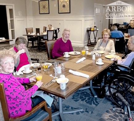 a group of senior women enjoying their meals