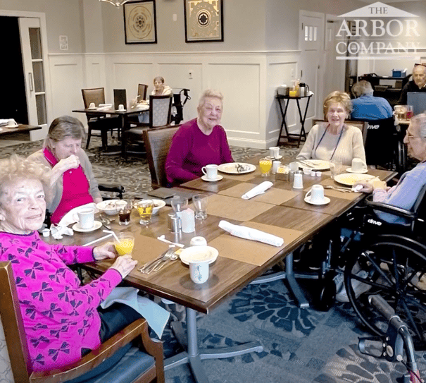 a group of senior women enjoying their meals