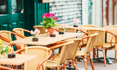 Colorful outdoor cafe tables at Calle Ocho in Little Havana, a vibrant cultural destination near this senior living community in Miami, FL, celebrating the rich heritage of Miami's Latin community.