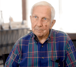 A resident at Arbor Terrace Lakeway with a calm and thoughtful expression, reflecting the comfort and dignity experienced every day in this senior living Lakeway Texas community.