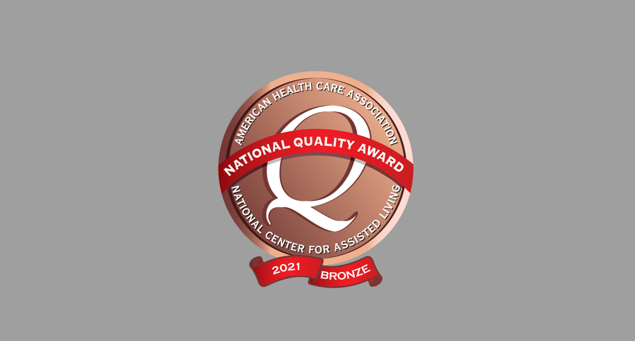 The 2021 AHCA National Quality Award Bronze badge, recognizing Arbor Terrace Morris Plains for its commitment to excellence in assisted living care in Morris Plains, NJ.