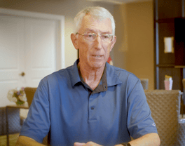 A resident at Arbor Terrace Glenview senior living shares a warm smile in a relaxed indoor setting, reflecting the active senior lifestyle Glenview is known for.