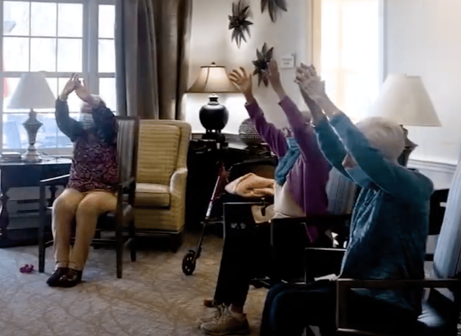 Arbor Terrace Willistown residents doing chair yoga