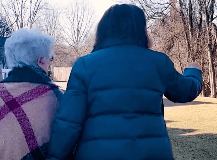 Arbor Terrace Resident and Staff Member Walking Outside