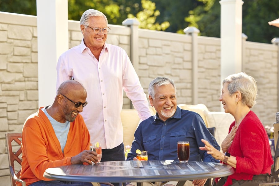 arbor terrace residents socializing on outdoor patio