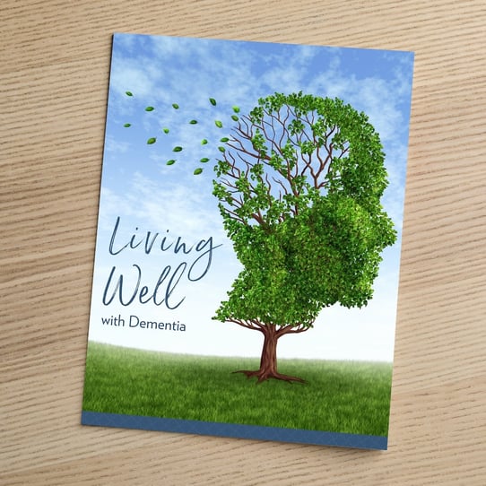 Cover of the "Living Well with Dementia" guide, featuring an illustrated tree in the shape of a human profile, offered by Arbor Terrace South Forsyth memory care community in Suwanee, GA.