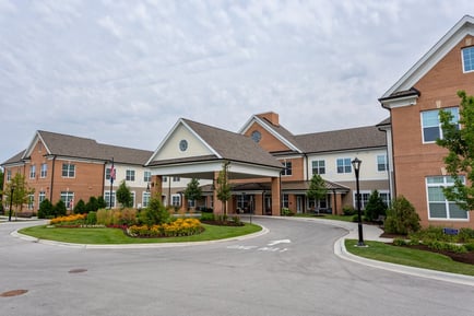 The welcoming brick exterior and manicured landscaping showcase the charm of an assisted living community and top-rated senior living in Glenview, IL.