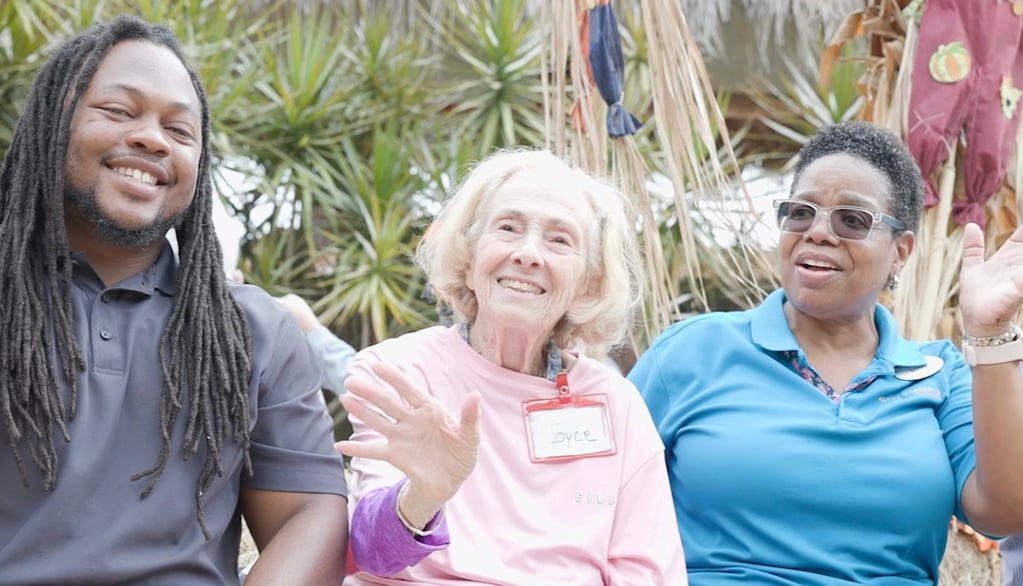 Arbor terrace employees smiling with resident