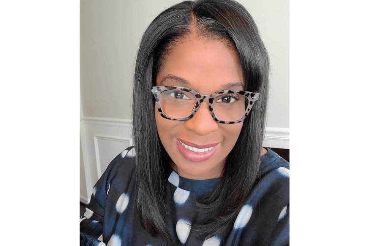 A smiling staff member poses for a warm and friendly headshot at Arbor Terrace Waugh Chapel.