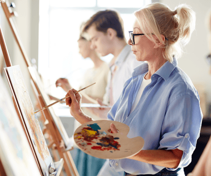 arbor terrace resident in art class