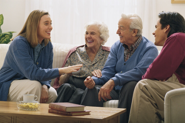 Exton residents and family chatting on a couch
