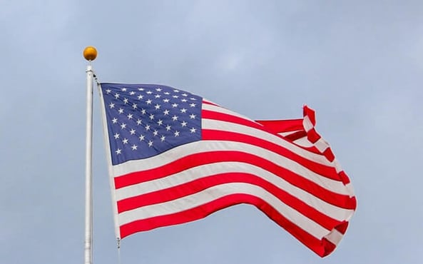 usa-flag-waving-on-white-metal-pole-1550342 (1)