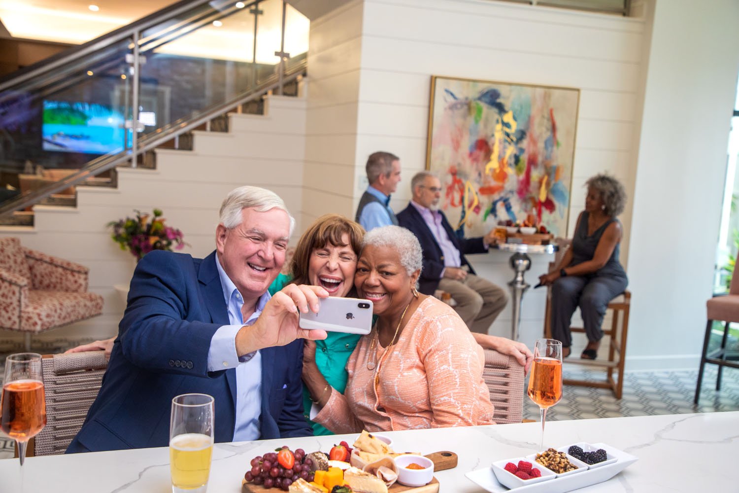 seniors taking a selfie at the bar