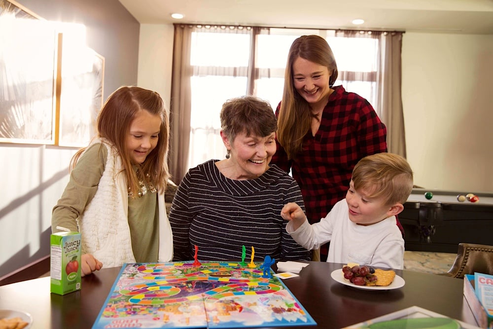 Senior woman playing games with her family