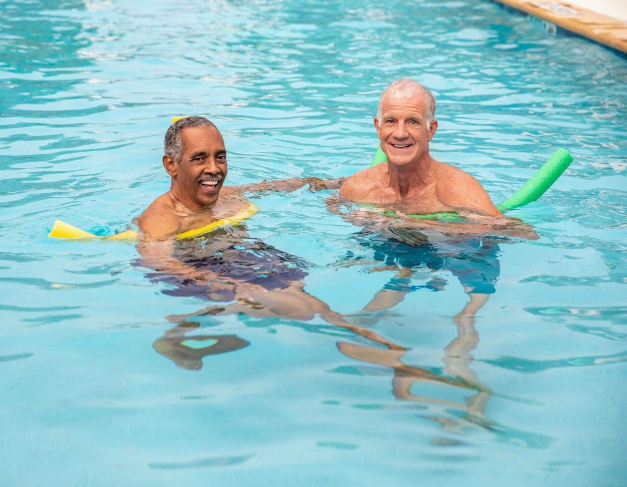Seniors enjoying the pool at Arbor